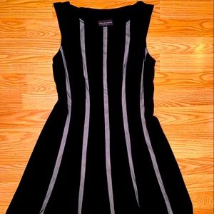 Sleeveless fitted top black knee length dress with sheer white stripes